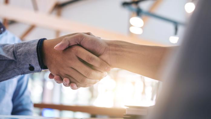 man and woman shaking hands (closeup)