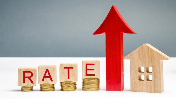 Coins and the word rate show home mortgage rate increases