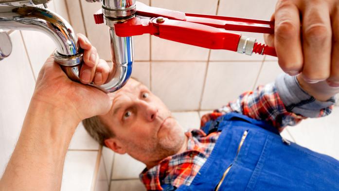 Man fixing plumbing