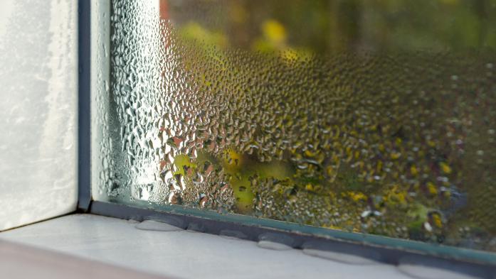 Corner of an outdoor window with a water leak