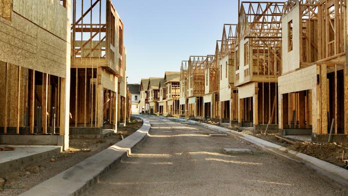 Street lined with homes under construction