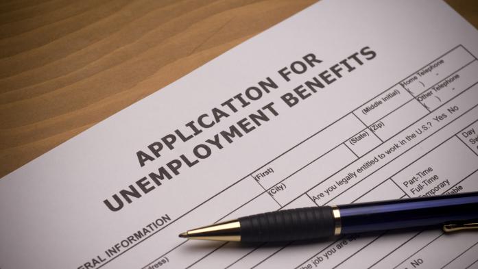 unemployment application and pen