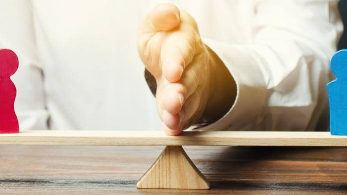 Arbitration, hand on board between wooden people