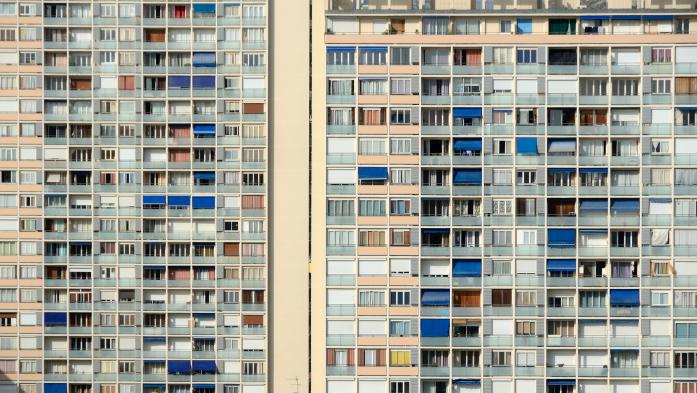 Side of building with hundreds of apartments