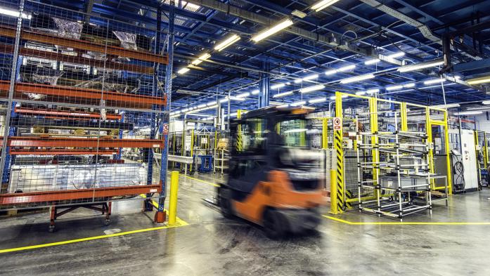 Inside of a large warehouse with stocked shelves for distribution