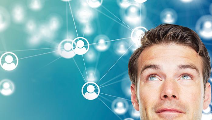 Man looking up at network of people