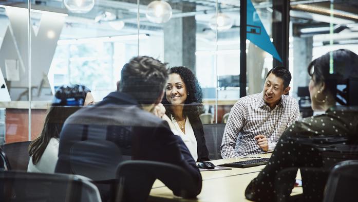 Photo of team of business people in a conference room