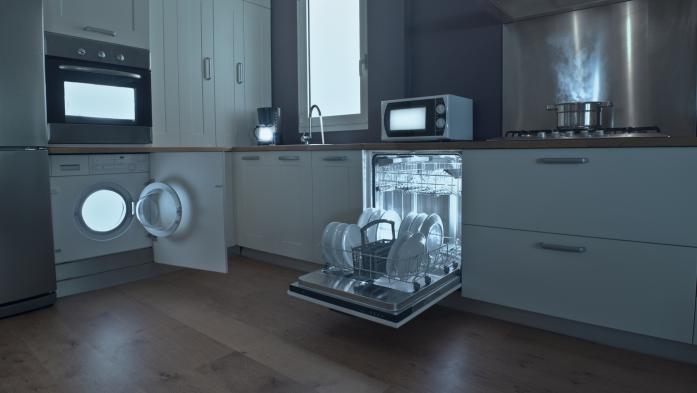 Kitchen with lights inside dishwasher, stove, washer and microwave