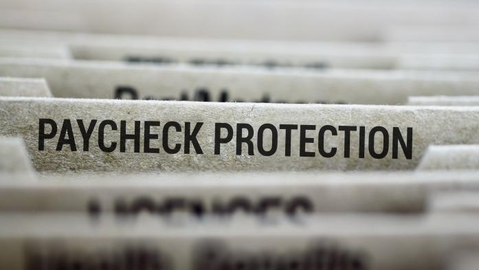 File folder with paycheck protection in focus