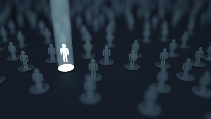 photo illustration of crowd with one person in the spotlight