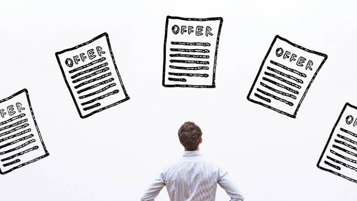 Photo of a man looking up at multiple offers floating above his head