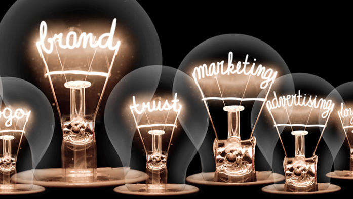 Photo illustration of lightbulbs with the words, brand, design, logo, marketing etc inside the bulbs