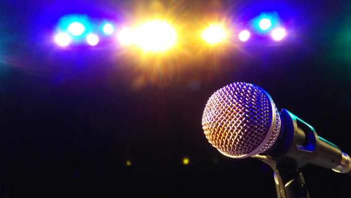 Microphone illuminated in spotlight