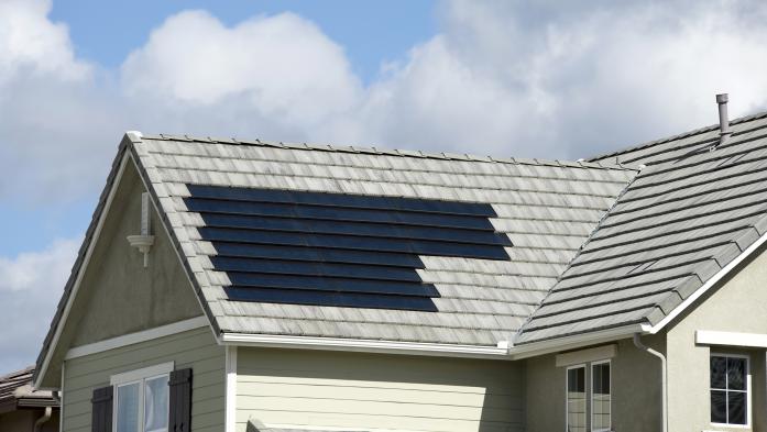 Roof with both solar shingles and regular shingles